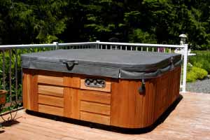 Wooden hot tub with closed cover on deck